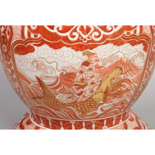 178 - A large Japanese Meiji period Kutani floor vase. With scrolling dragon handles and painted in red en... 