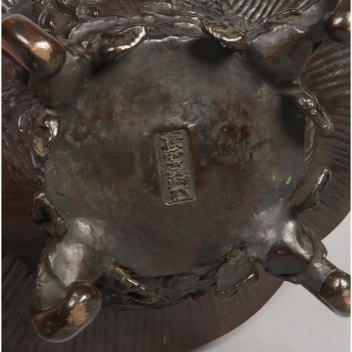 187 - A Japanese Meiji period bronze koro base of quatrefoil form. Decorated with a dragon and a kirin and... 