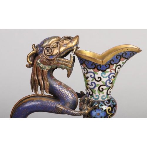 198 - A fine pair of 19th century Chinese cloisonne ewers. Each with a handle modelled in the form of a dr... 