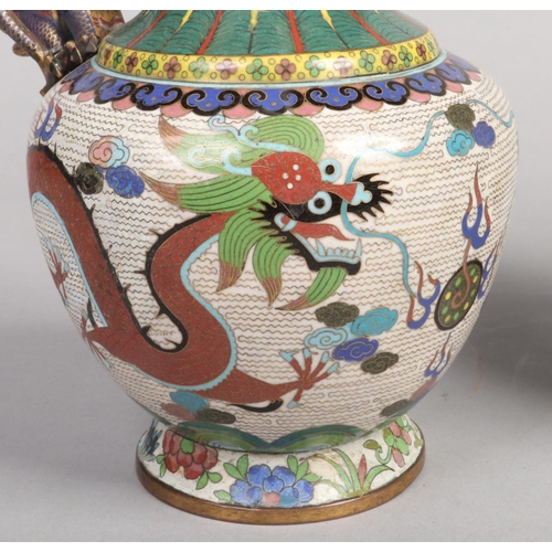 198 - A fine pair of 19th century Chinese cloisonne ewers. Each with a handle modelled in the form of a dr... 