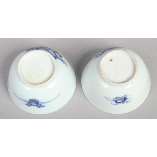 234 - A pair of 18th century Chinese blue and white teabowls. Painted in underglaze blue with pine trees, ... 