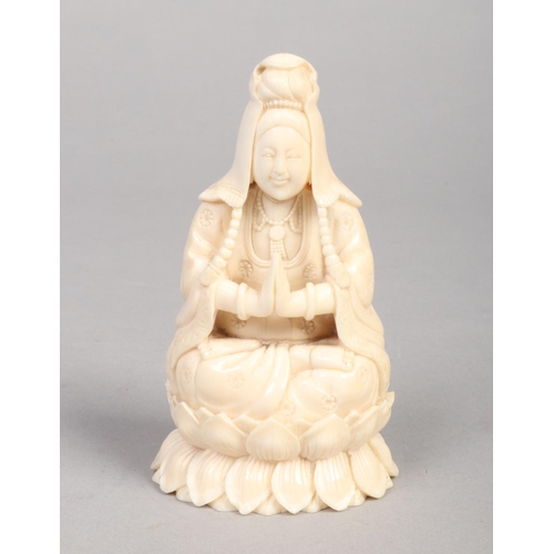 240 - A 19th century Cantonese carved ivory figure of a seated Buddha raised on a lotus plinth, 12.5cm, 29... 