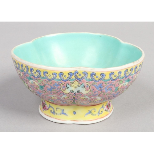 243 - A Chinese Qing dynasty trefoil shaped bowl. Painted with lotus scrolls to the exterior and with a tu... 