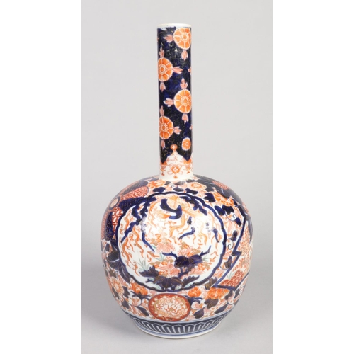 247 - A Japanese Meiji period large Imari bottle vase. Decorated with panels of birds and two pheonix, 46c... 