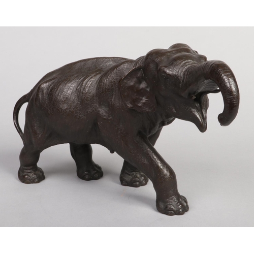 248 - A Japanese Meiji period patinated bronze sculpture of an elephant, 44cm long.