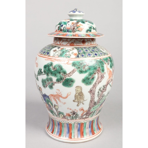 249 - A 20th century Chinese baluster ginger jar and cover. Decorated in the famille verte style with a la... 