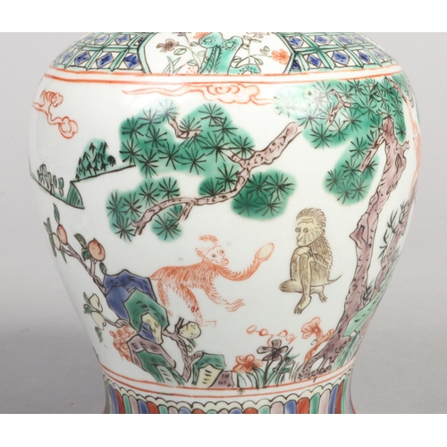 249 - A 20th century Chinese baluster ginger jar and cover. Decorated in the famille verte style with a la... 