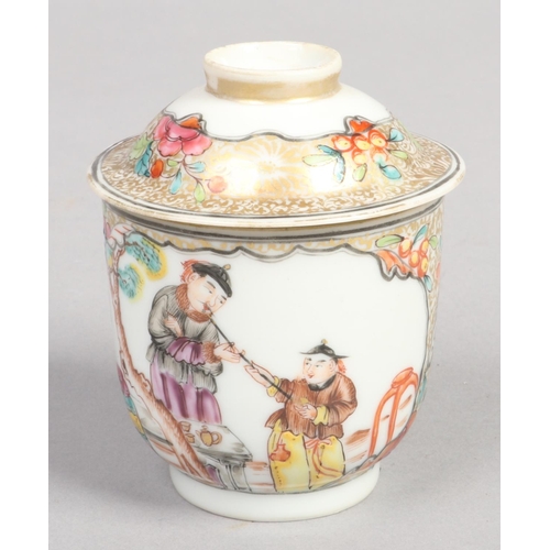 251 - An 18th century Chinese wine cup and cover. Painted in polychrome enamels with Mandarin figures on g... 