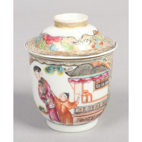 251 - An 18th century Chinese wine cup and cover. Painted in polychrome enamels with Mandarin figures on g... 