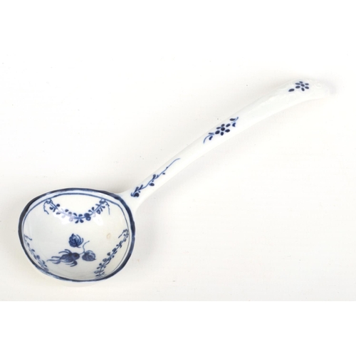 135 - A rare Caughley small ladle. With delicate scroll and shell mouldings, painted in underglaze blue wi... 