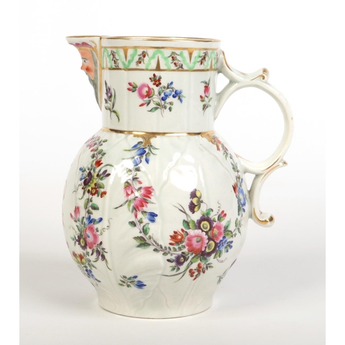 158 - A fine Worcester cabbage leaf moulded mask jug. Enamelled with flower garlands and with a gilt ciphe... 