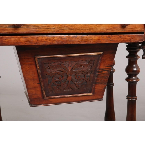 697 - A Victorian rosewood work table raised on turned supports. With fold over inlaid gaming top, 75cm hi... 