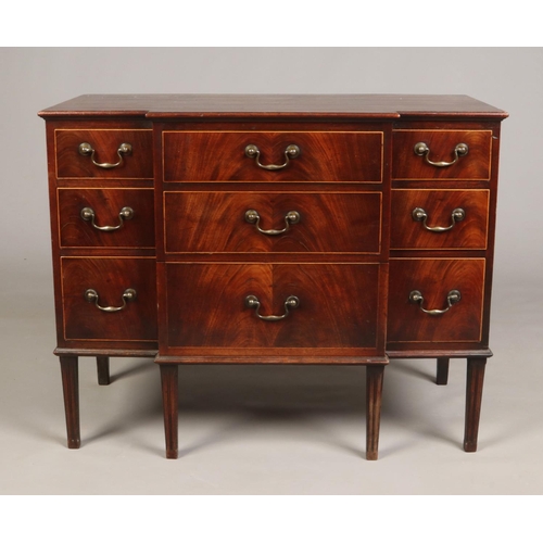 698 - A George III mahogany breakfront dressing chest. Oak lined, with bronze drop handles and raised on r... 