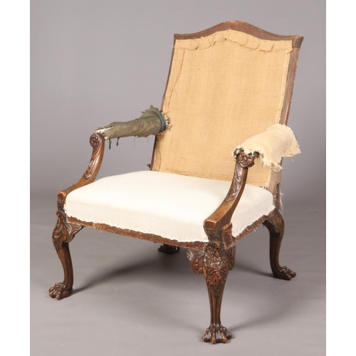 700 - A 19th century Irish carved mahogany Gainsborough armchair. 110cm high, 77cm wide, 76cm deep, seat 4... 