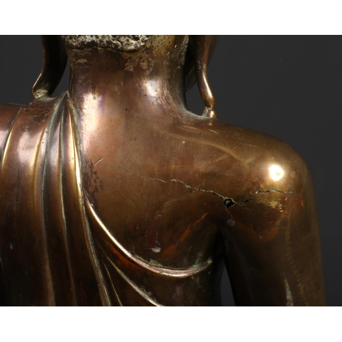 175 - A large 17th century Sino-Tibetan bronze statue of Buddha Shakyamuni. With glass inset eyes and seat... 