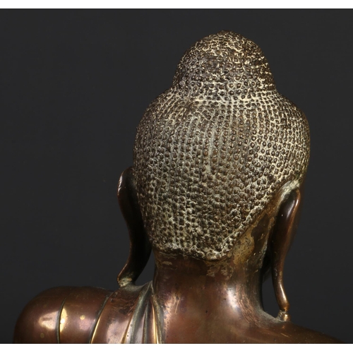 175 - A large 17th century Sino-Tibetan bronze statue of Buddha Shakyamuni. With glass inset eyes and seat... 