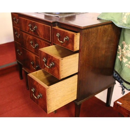 698 - A George III mahogany breakfront dressing chest. Oak lined, with bronze drop handles and raised on r... 