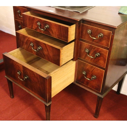 698 - A George III mahogany breakfront dressing chest. Oak lined, with bronze drop handles and raised on r... 