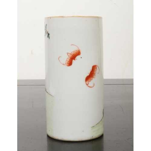 215 - A 19th century Chinese cylindrical brush pot. Painted in coloured enamels with a warrior and attenda... 