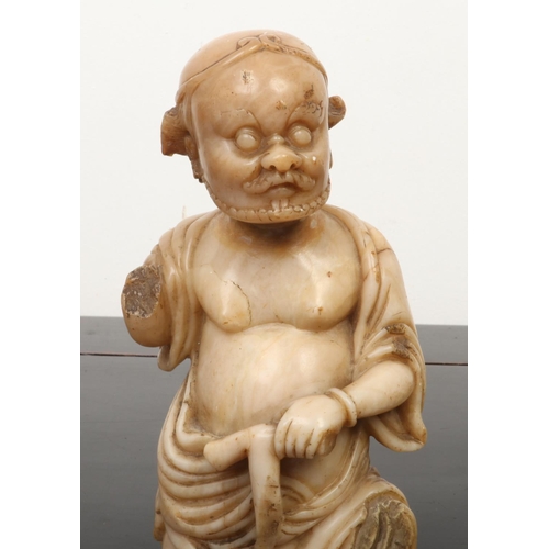 213 - A late 17th / early 18th century Chinese carved soapstone figure of Li Tieguai. The bearded figure i... 