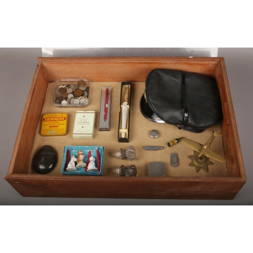 63 - A bijouterie case of collectables, to include coins, cap with constable badge, pen knives etc.