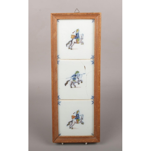 71 - Three 19th century polychrome delft tiles framed as one. Each painted to depict a mounted soldier, 3... 