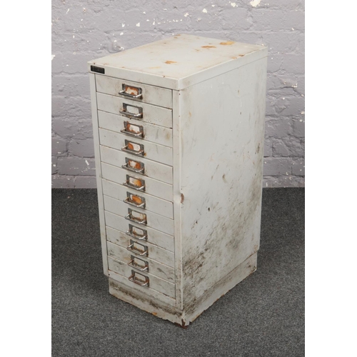 741 - A triumph twelve drawer steel filing cabinet.