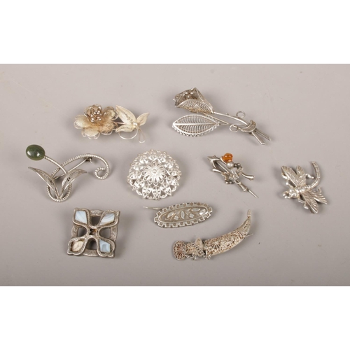 366 - Nine silver and white metal brooches, to include filigree examples.