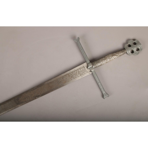 5 - A decorative Toledo sword, marked Tanto Monta (Length 121cm).