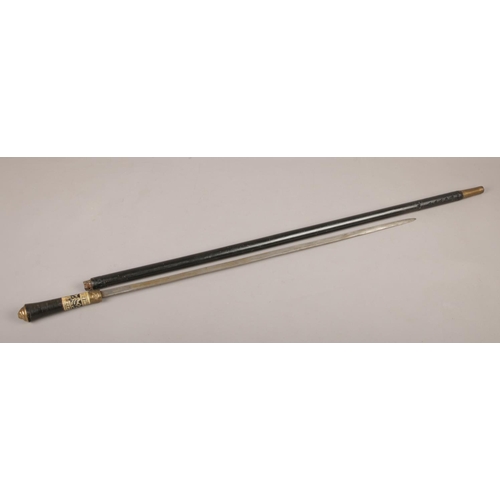 465 - An ebonised sword stick, with brass lion mask pommel. (Length 92cm).