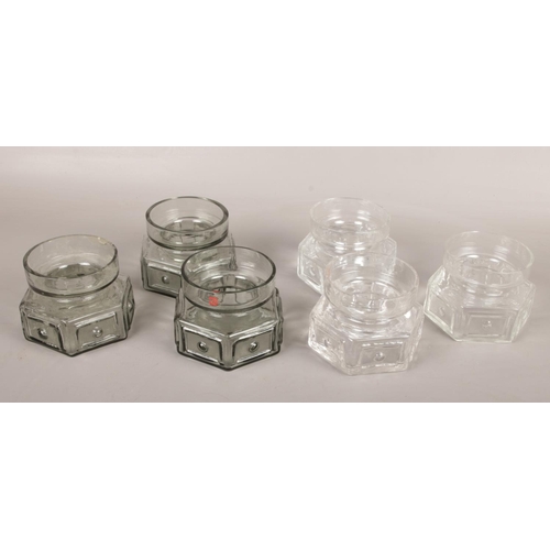 504 - Six Dartington glass hexagonal candle holders by Frank Thrower. FT88 with moulded panel and spot pat... 