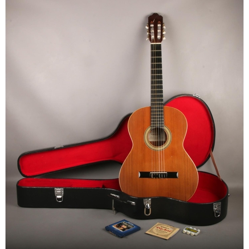 A cased Cuenca Model 10 Spanish acoustic guitar, dated to label 1986.