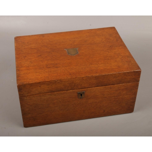 133 - An Oak Sewing box (approx 31 cm wide 23 cm long) with contents