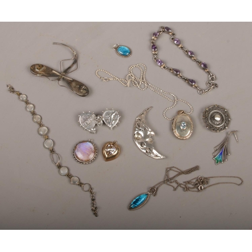 438 - A box of silver jewellery including a teardrop amethyst bracelet, moonstone and butterfly wing piece... 