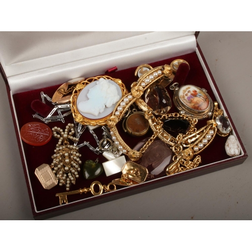 440 - A box of jewellery and collectables including glass intaglio, middle eastern carnelian seal, gilt an... 