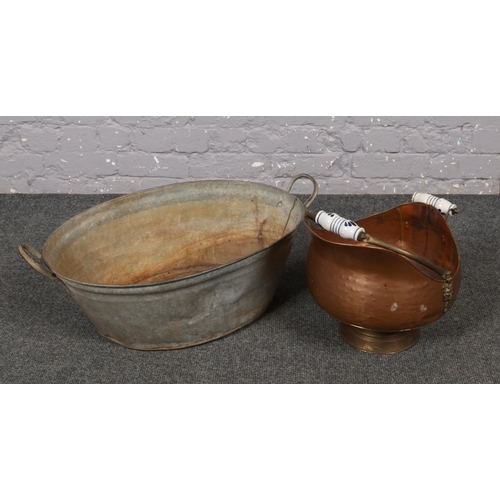 542 - A galvanised twin handle planter, along with a copper coal scuttle.