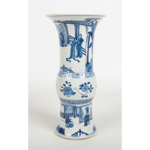 488 - A Chinese blue and white gu shaped vase. Painted in underglaze blue with figures in an outdoor setti... 