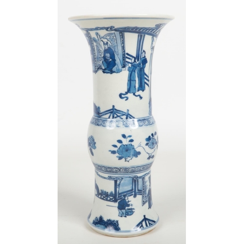 488 - A Chinese blue and white gu shaped vase. Painted in underglaze blue with figures in an outdoor setti... 