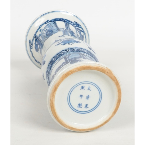 488 - A Chinese blue and white gu shaped vase. Painted in underglaze blue with figures in an outdoor setti... 