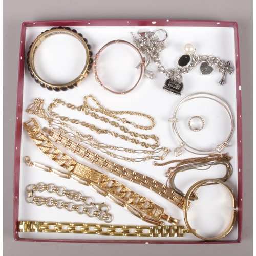 203 - A collection of costume jewellery bracelets, to include Juicy Couture, gilt metal examples etc.