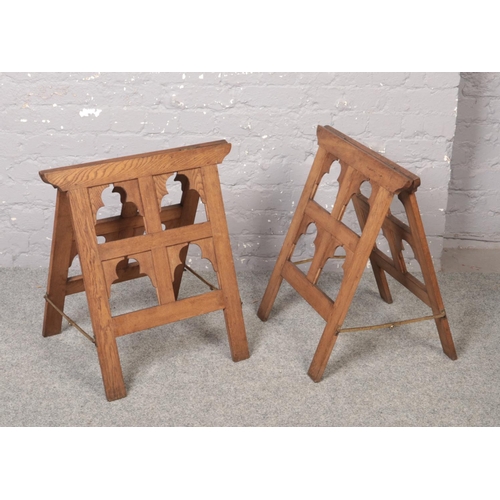 72 - A pair of oak Gothic revival coffin trestles of pegged construction and with brass stays, 59cm high,... 