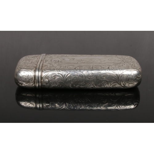 74 - A Victorian silver cigar case by Alfred Taylor. With a ground of engraved scrollwork and two cartouc... 