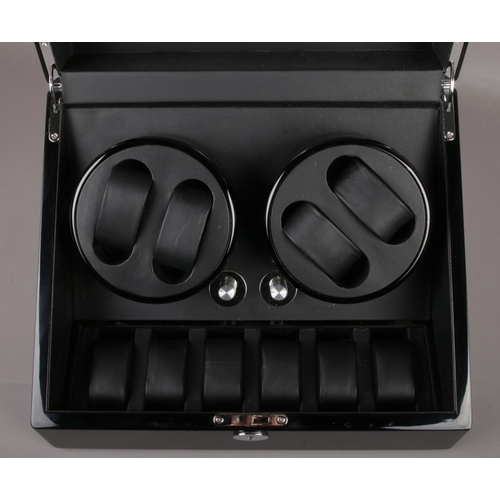 587 - A lockable electric automatic watch winder.