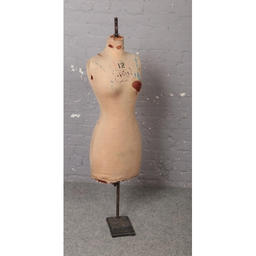 82 - A vintage Yugin & Sons tailors dummy or mannequin. Female in form, stencilled number 12 and with Yug... 