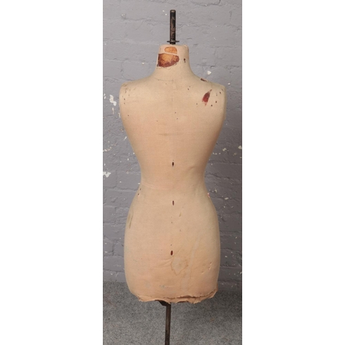 82 - A vintage Yugin & Sons tailors dummy or mannequin. Female in form, stencilled number 12 and with Yug... 