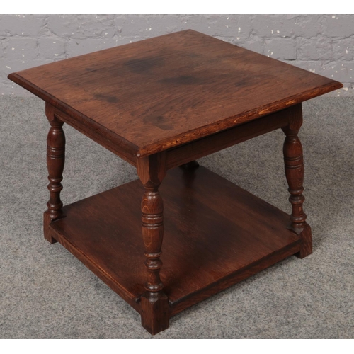 621 - An Archer & Smith oak two tier occasional table.