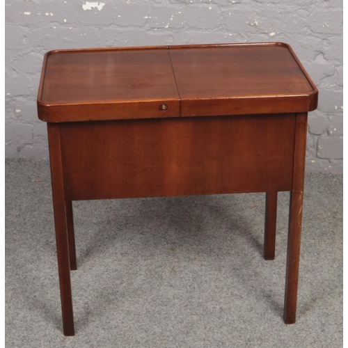 626 - A Mahogany fitted sewing table with spring loaded mechanism ( approximately 63 cm x 38 cm)