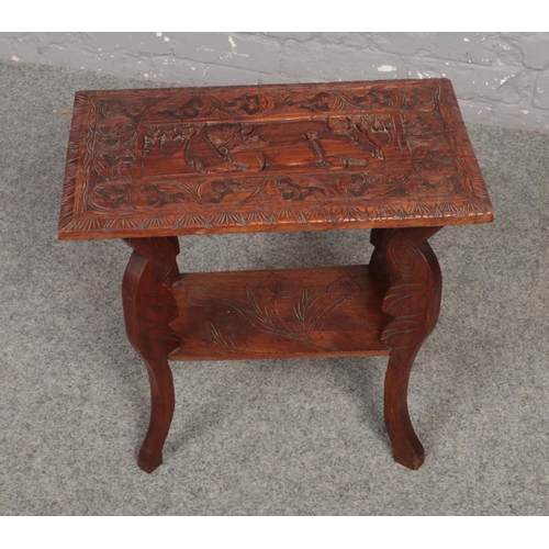 627 - A wooden carved oriental style side table ( approximately 52 cm x 30 cm)