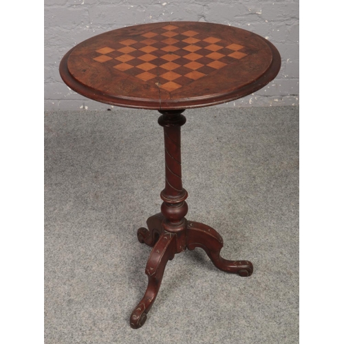 631 - A Victorian walnut games table.