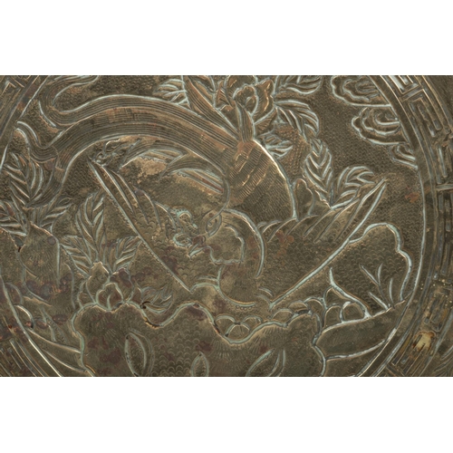 137 - A pair of 20th century Chinese bronze chargers. One chased with a dragon and the other a phoenix, 40... 